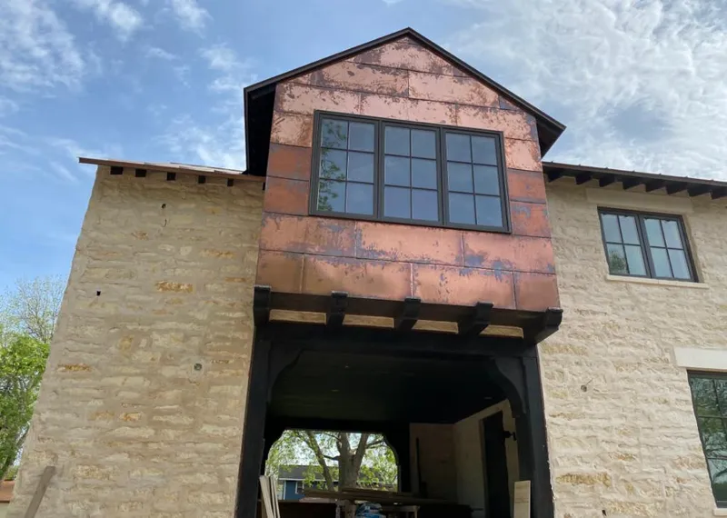 Copper metal panel facade on a stone building for Metal Roof Coating in Shively
